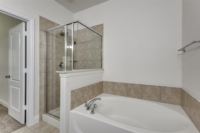 bathroom with tile patterned flooring and plus walk in shower