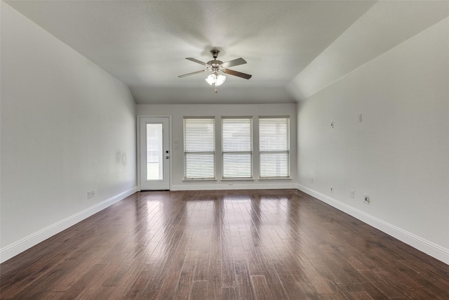 unfurnished room with ceiling fan, dark hardwood / wood-style floors, and lofted ceiling