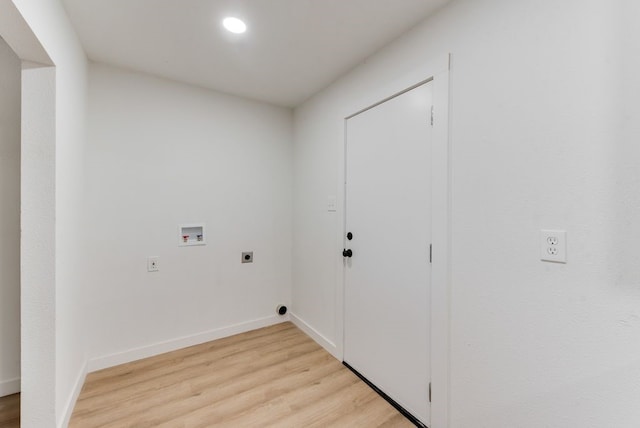 laundry area with light hardwood / wood-style floors, hookup for a washing machine, and electric dryer hookup