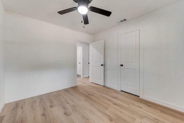 unfurnished bedroom featuring ceiling fan and light wood-type flooring