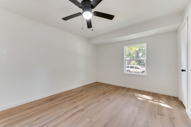 empty room with light hardwood / wood-style flooring