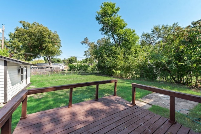 wooden deck featuring a yard