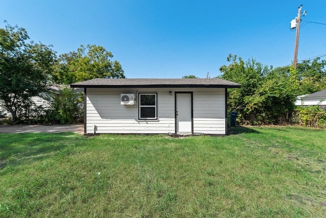 view of outbuilding featuring a yard