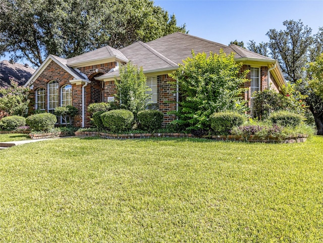 view of front of property with a front lawn