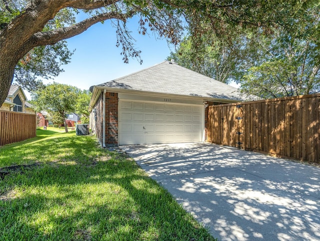 garage featuring a lawn