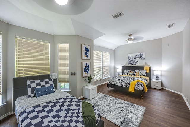 bedroom with ceiling fan, dark hardwood / wood-style floors, and lofted ceiling