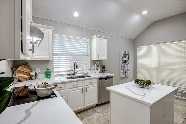 kitchen featuring dishwasher, white cabinetry, sink, and vaulted ceiling