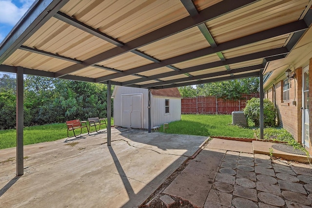 view of patio featuring central AC unit and a storage unit