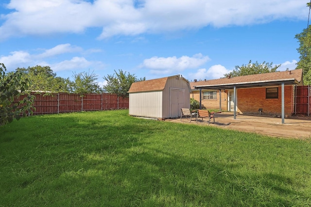 view of yard with a shed and a patio