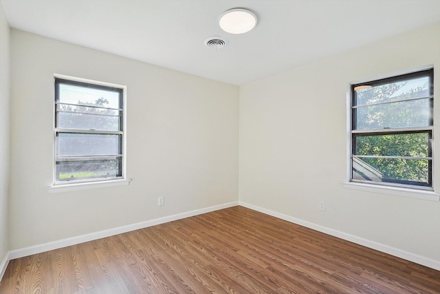 empty room with wood-type flooring