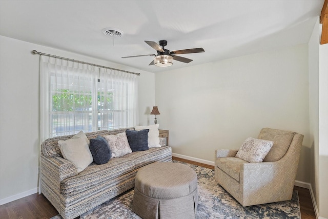 living room with hardwood / wood-style flooring and ceiling fan