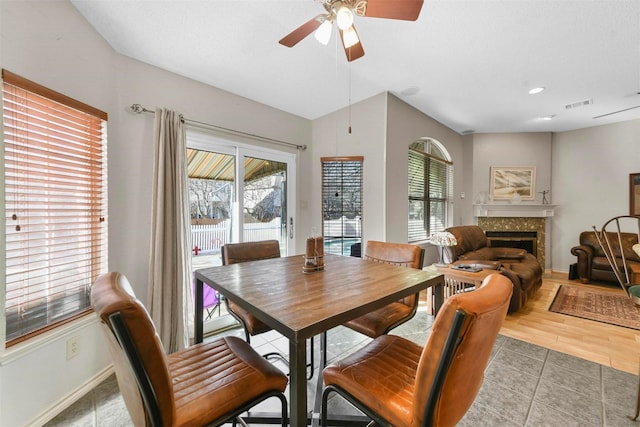 tiled dining room with ceiling fan