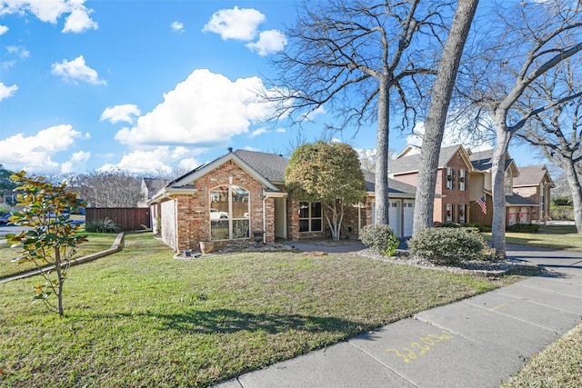 view of front of property featuring a garage and a front lawn