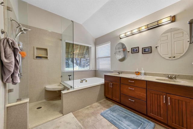 bathroom featuring a textured ceiling, vanity, plus walk in shower, tile patterned flooring, and lofted ceiling