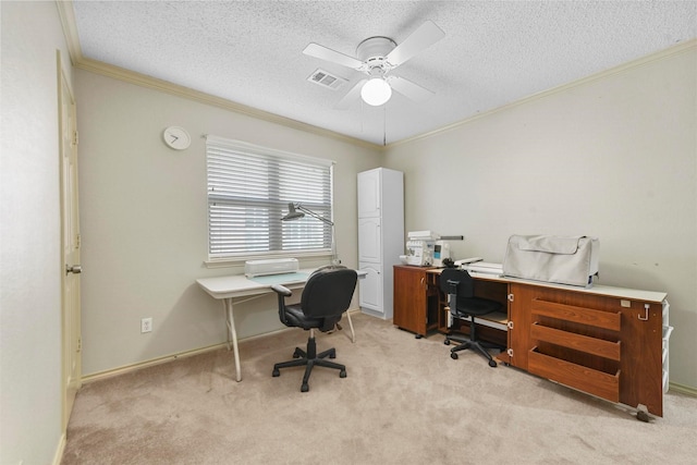 office space featuring light carpet, ceiling fan, a textured ceiling, and ornamental molding