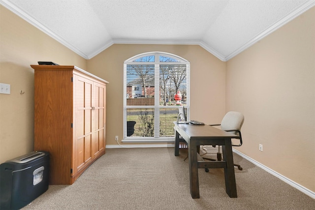 carpeted office space featuring a healthy amount of sunlight, lofted ceiling, and crown molding