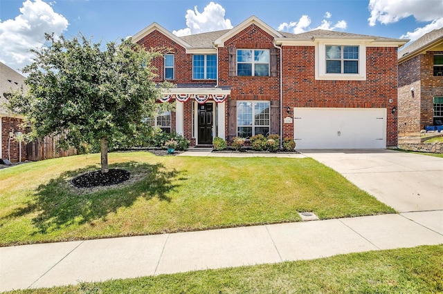 view of front of house featuring a front lawn and a garage