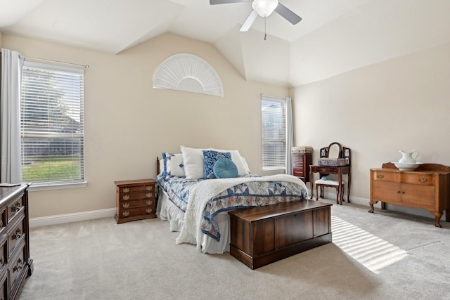 carpeted bedroom featuring vaulted ceiling and ceiling fan