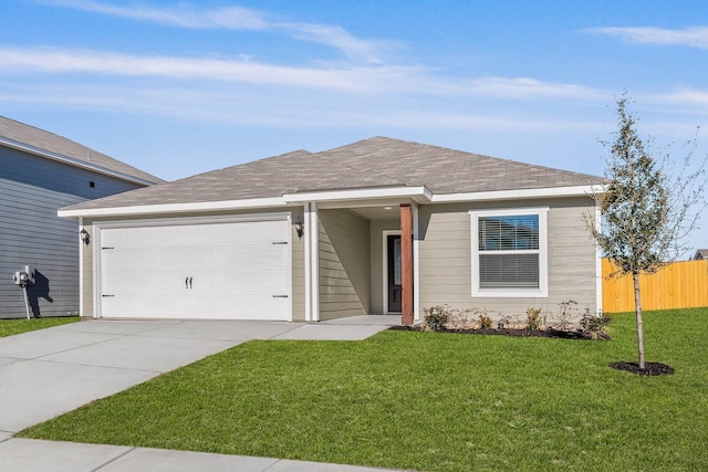 ranch-style house featuring a garage and a front lawn