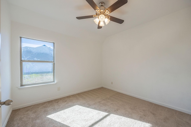 unfurnished room with light colored carpet and ceiling fan