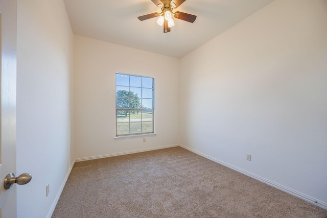 unfurnished room with ceiling fan and light colored carpet