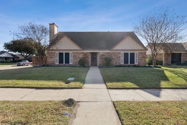 ranch-style home with a front lawn