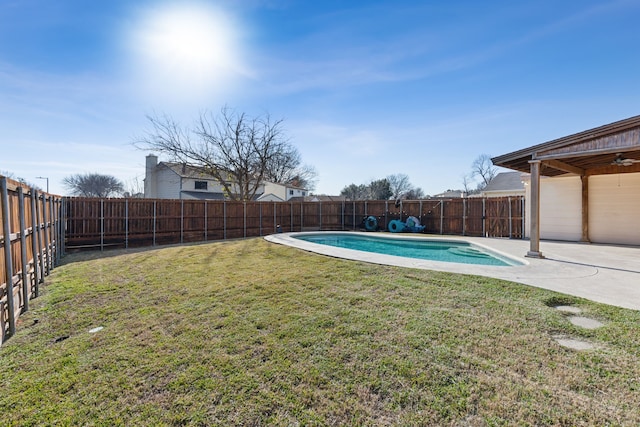 view of yard with a fenced in pool and a patio area