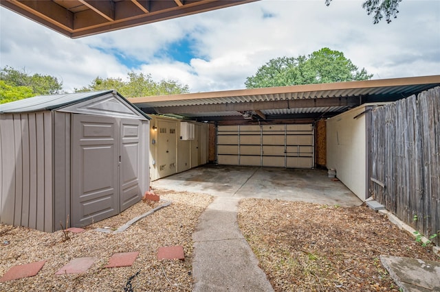 exterior space with a storage shed and a carport