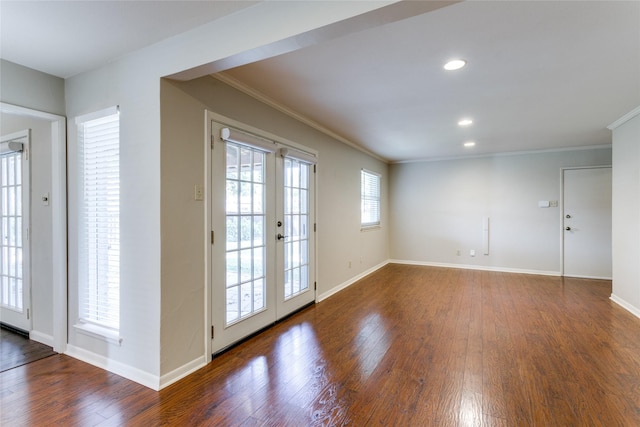 doorway to outside featuring dark hardwood / wood-style flooring, crown molding, and french doors