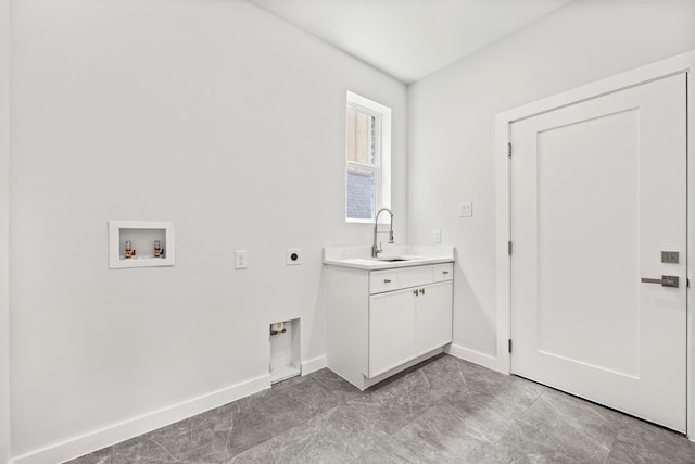 laundry area with cabinets, washer hookup, electric dryer hookup, and sink