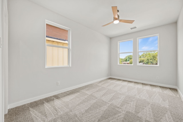 unfurnished room with carpet flooring and ceiling fan