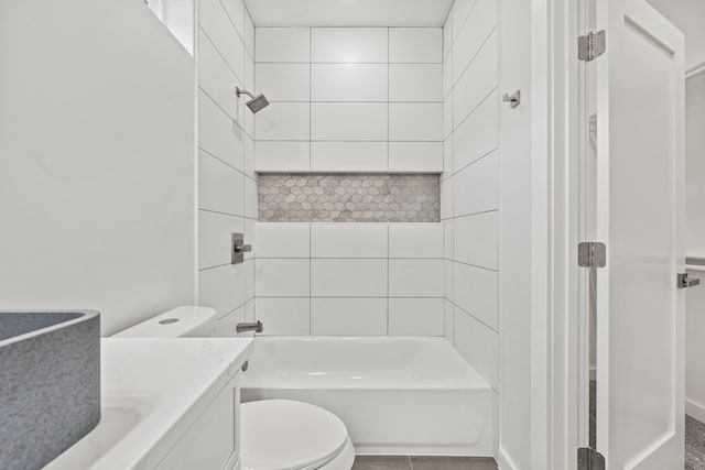 full bathroom with vanity, tiled shower / bath combo, and toilet