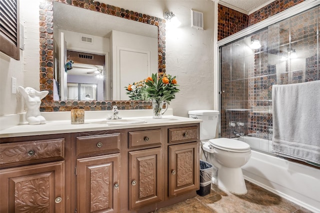 full bathroom featuring shower / bath combination with glass door, vanity, and toilet