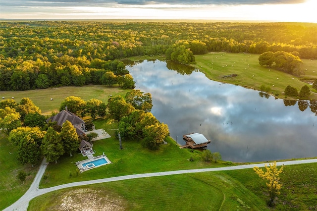 aerial view at dusk with a water view