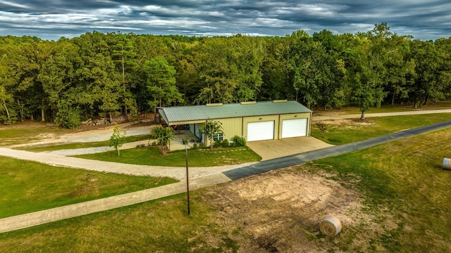 view of community featuring a yard and an outbuilding