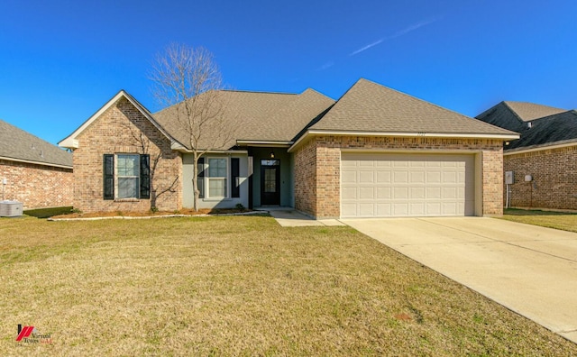 view of front of house with a garage and a front yard