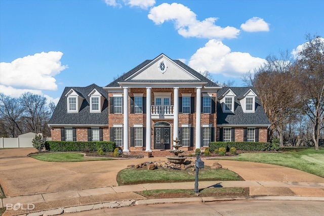 greek revival house with a front lawn