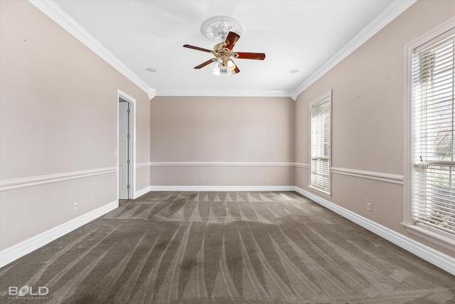 carpeted empty room featuring crown molding, ceiling fan, and a healthy amount of sunlight