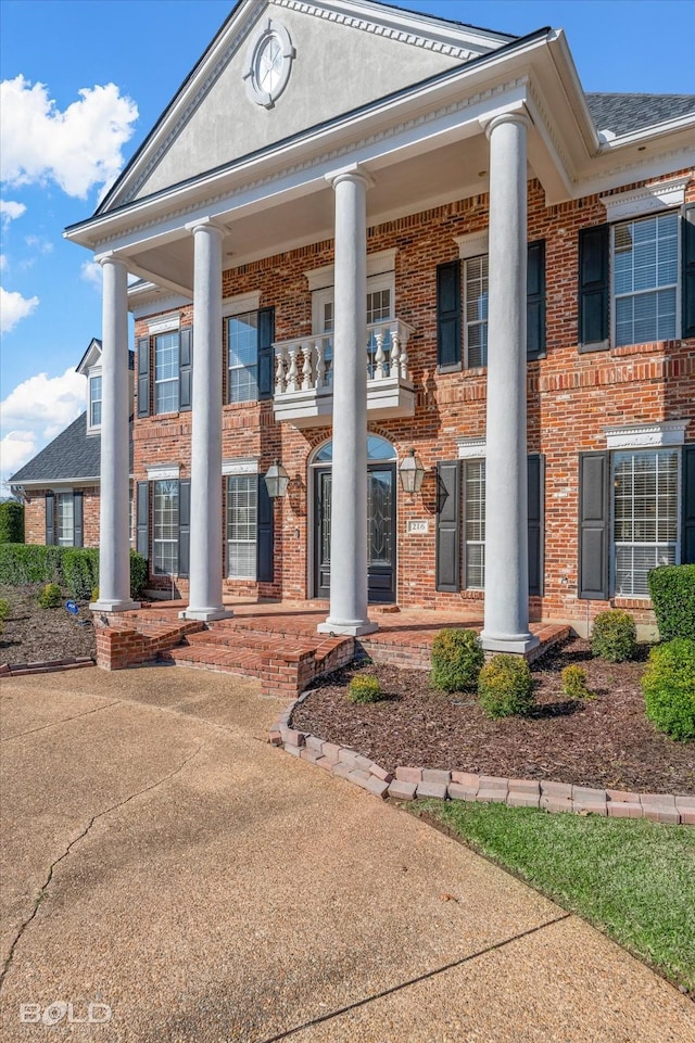 neoclassical home with a porch