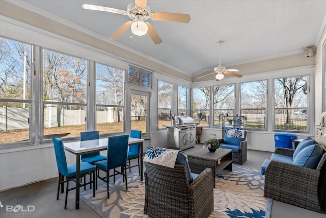 sunroom featuring ceiling fan