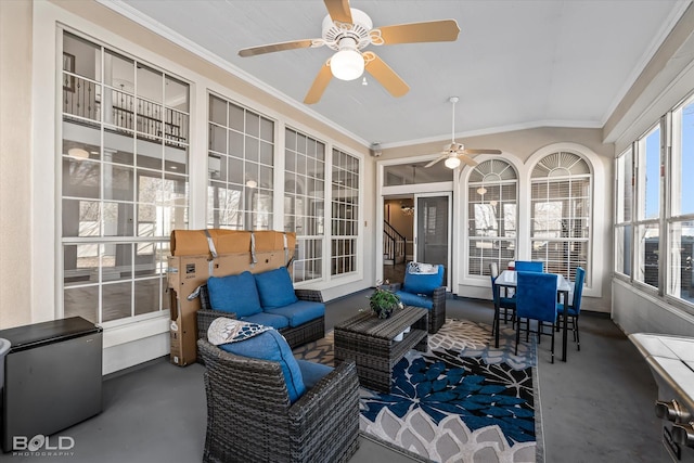 sunroom featuring ceiling fan