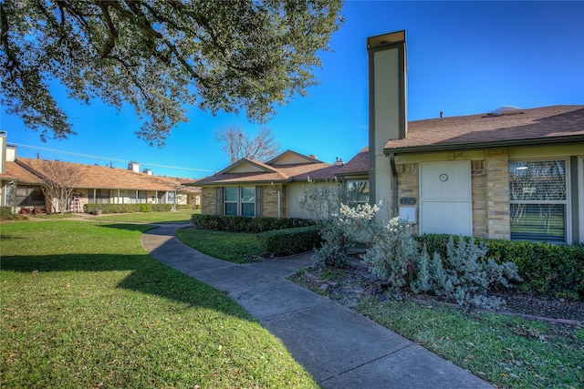 exterior space featuring a front yard