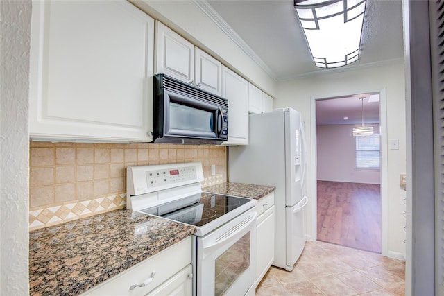 kitchen featuring white cabinetry, ornamental molding, white electric range, and dark stone counters