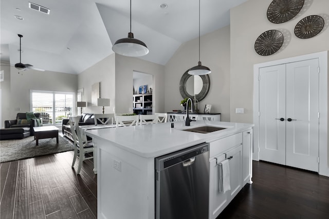 kitchen featuring sink, white cabinetry, hanging light fixtures, a center island with sink, and stainless steel dishwasher