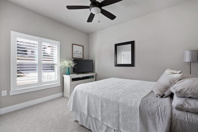 bedroom with light colored carpet and ceiling fan