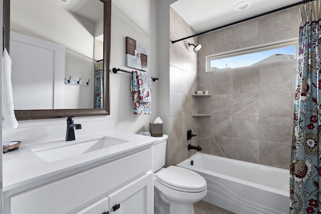 full bathroom with vanity, shower / tub combo, and toilet