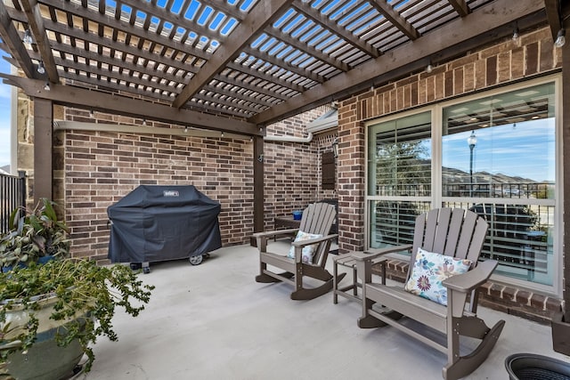 view of patio / terrace featuring a grill and a pergola