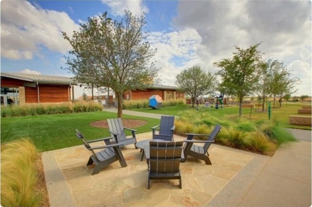 view of patio featuring an outdoor fire pit