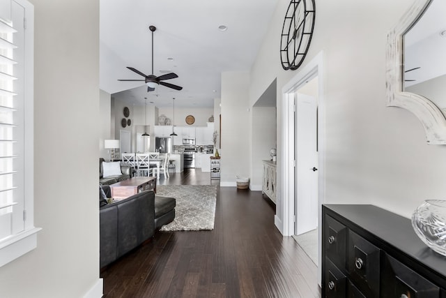 foyer with dark wood-type flooring and ceiling fan