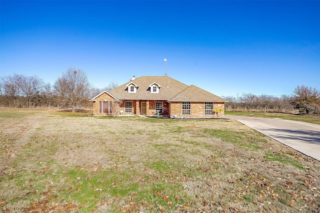 view of front of home with a front yard